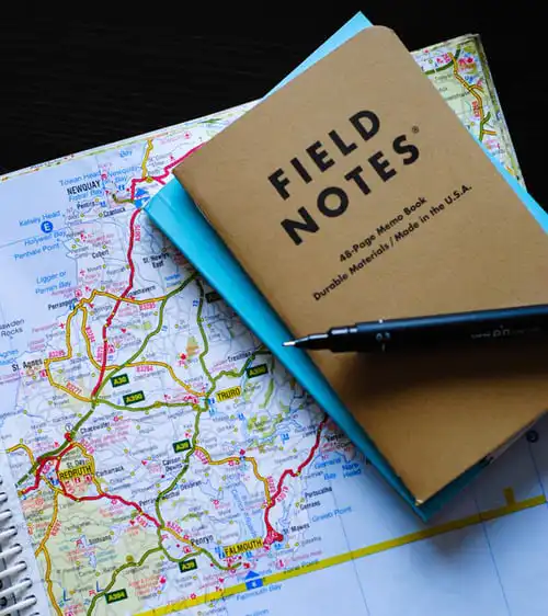 a man, two notebooks and a pen for SEO Class Training Tip