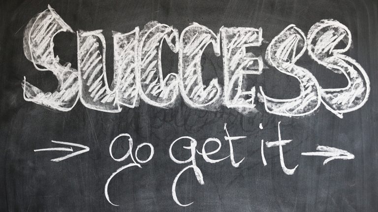 a word "success go get it" written in chalk portraying that marketing success is by learning SEO