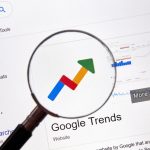Magnifying Glass and An Arrow Up for Google Trends Keyword Research SEO