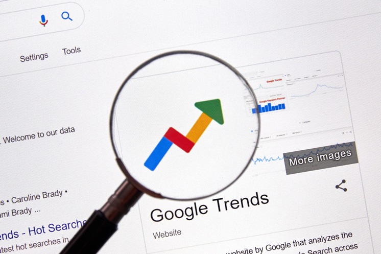 Magnifying Glass and An Arrow Up for Google Trends Keyword Research SEO