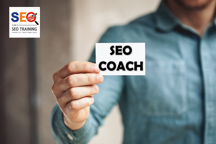 A Man Holding A Small Paper With SEO Coach promoting SEO coaching and Learn Search Engine Optimization