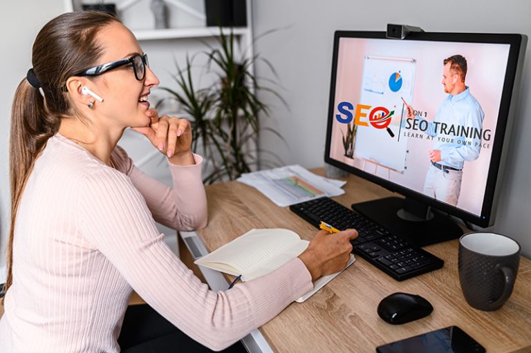 A Woman In Office Is Watching SEO Tutoring Classes Online