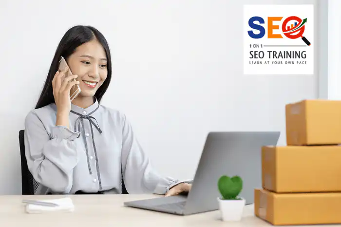 A Lady In front Of Her Laptop Talking To A Customer While Learning A Little Search Engine Optimization Can Easily Gain You More Customers