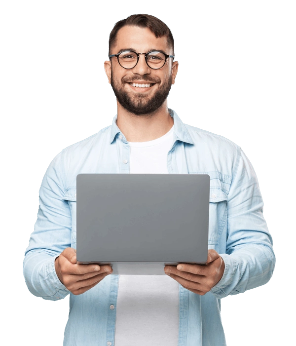 Man smiling and holding a gray laptop while on SEO training session