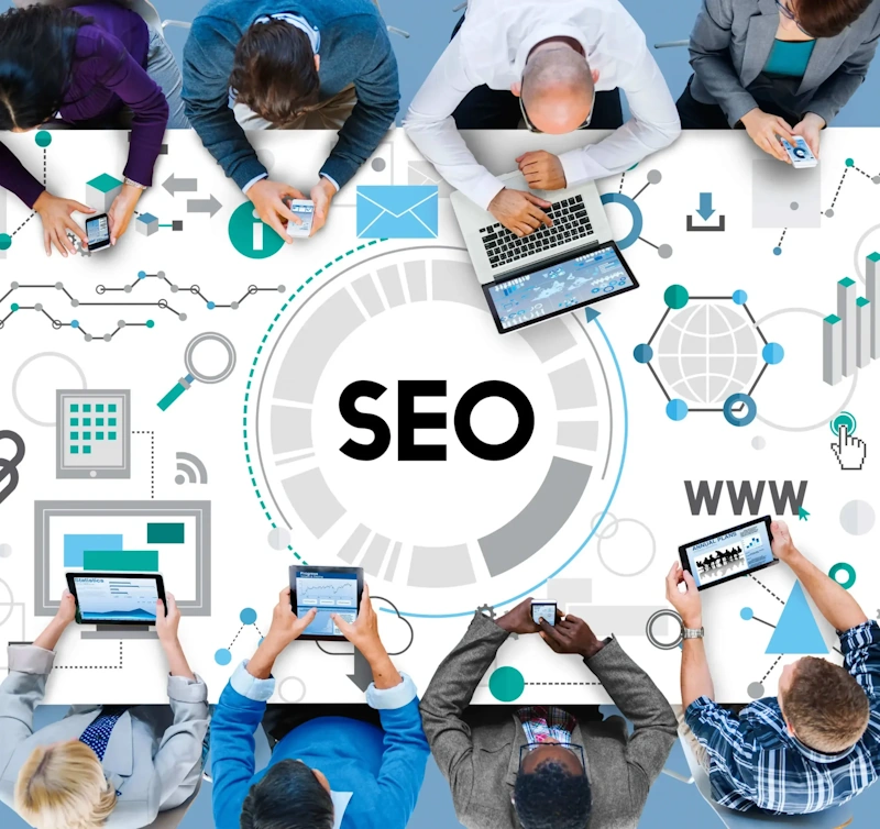 Coworkers learning SEO techniques in a workshop setting led by a hired SEO expert for coaching